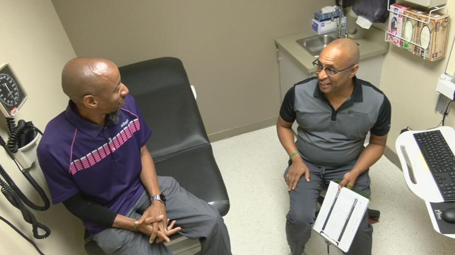 Norton Healthcare therapist Jonathan White (right) meets with Kary Goff (left), a patient