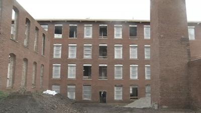 Crews work to transform the former Eagle Cotton Mill into hotel