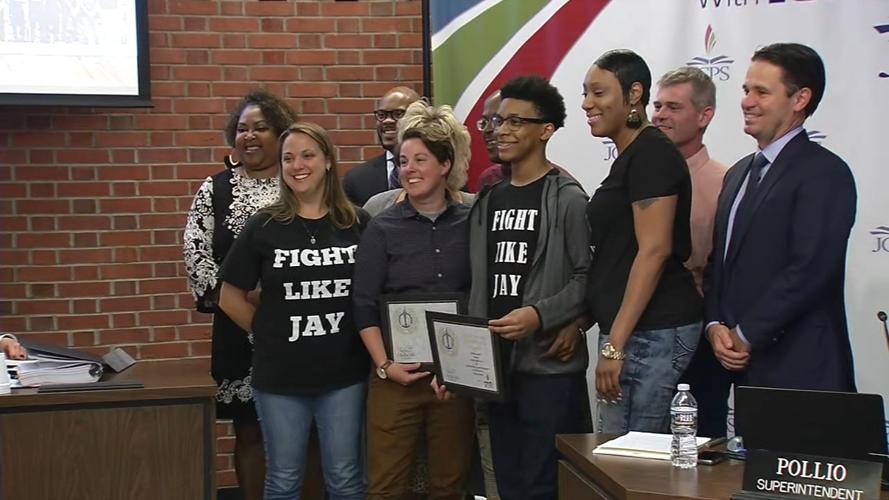Jamauren Woodard with JCPS staff members who saved his life