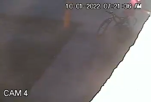 Surveillance footage of man breaking into drop box