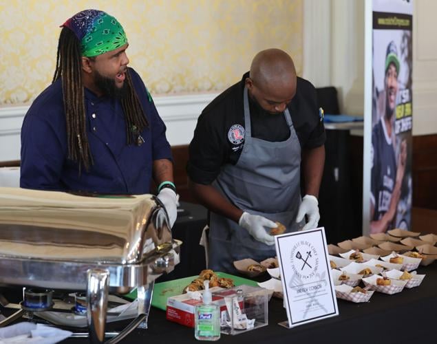 Vendors share food at Black Chef Showcase.JPG