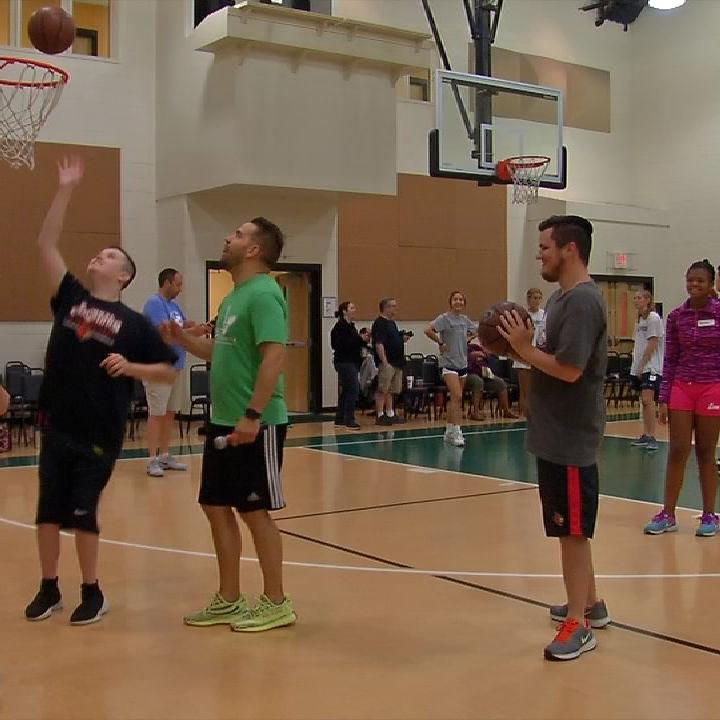 Ex- UofL star Luke Hancock spotlights autism with basketball clinic