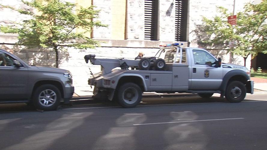 Anti-eviction protests LMPD car towing SUV 8-8-20