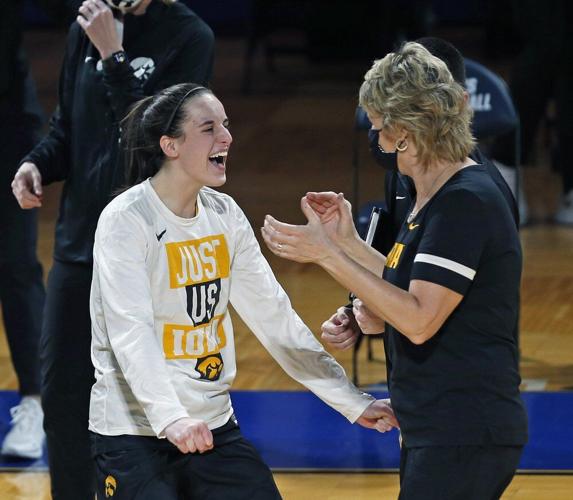 Iowa guard Caitlin Clark celebrates with coach Lisa Bluder