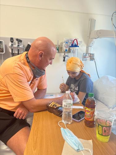 Alexis Bibb does homework in hospital bed