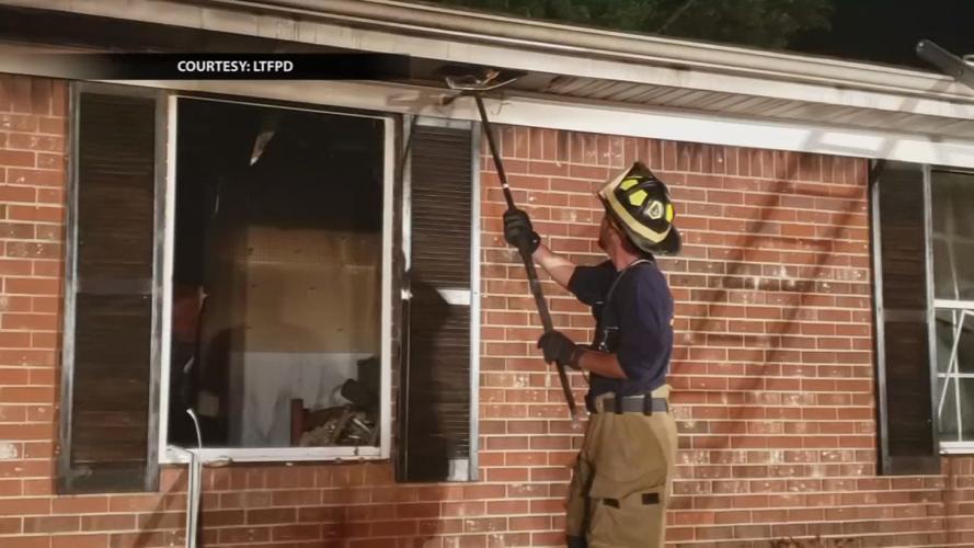 Firefighter works on house fire in southern Indiana