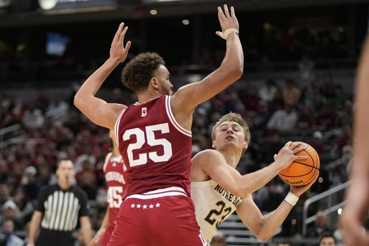 Notre Dame guard Dane Goodwin looks to drive around Indiana forward Race Thompson.jpeg