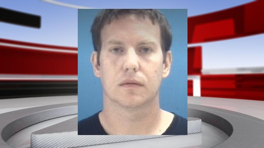 Michael K. Jones w background, Columbus, Indiana, guns on school property