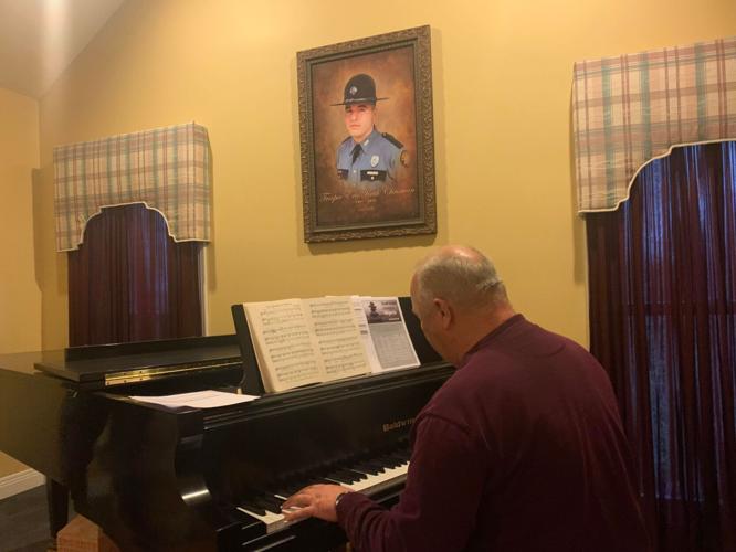 Randy Chrisman plays piano with Eric Chrisman image above