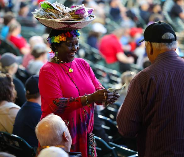 Kizito sells cookie at Slugger Field.JPG