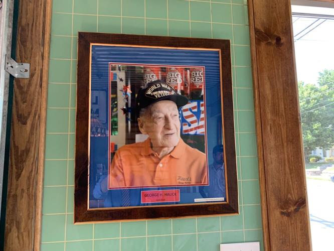 George Hauck photo hanging in remodeled Hauck's.jpg