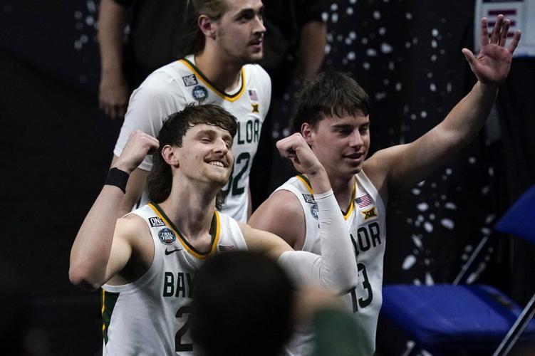 Baylor guard Matthew Mayer, left, celebrates as he walks off the court