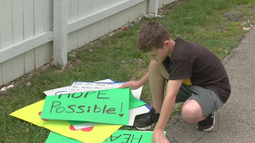 Hunter Reinert signs for Uncle Billy's bake sale.jpeg