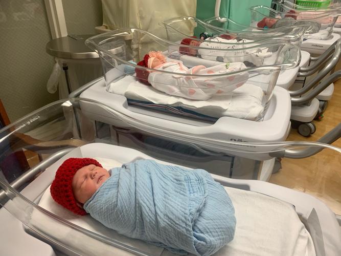 Babies in red hats for American Heart Month