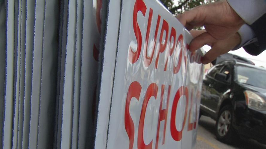 JCPS yard signs being given to parents
