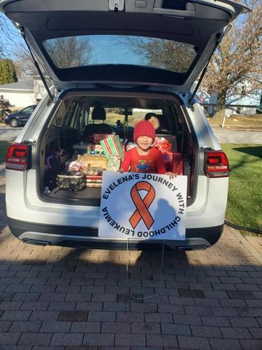Evelena Chee-Metternick with sign