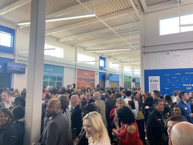 People wait for unveiling of West Louisville Opportunity Center.jpg