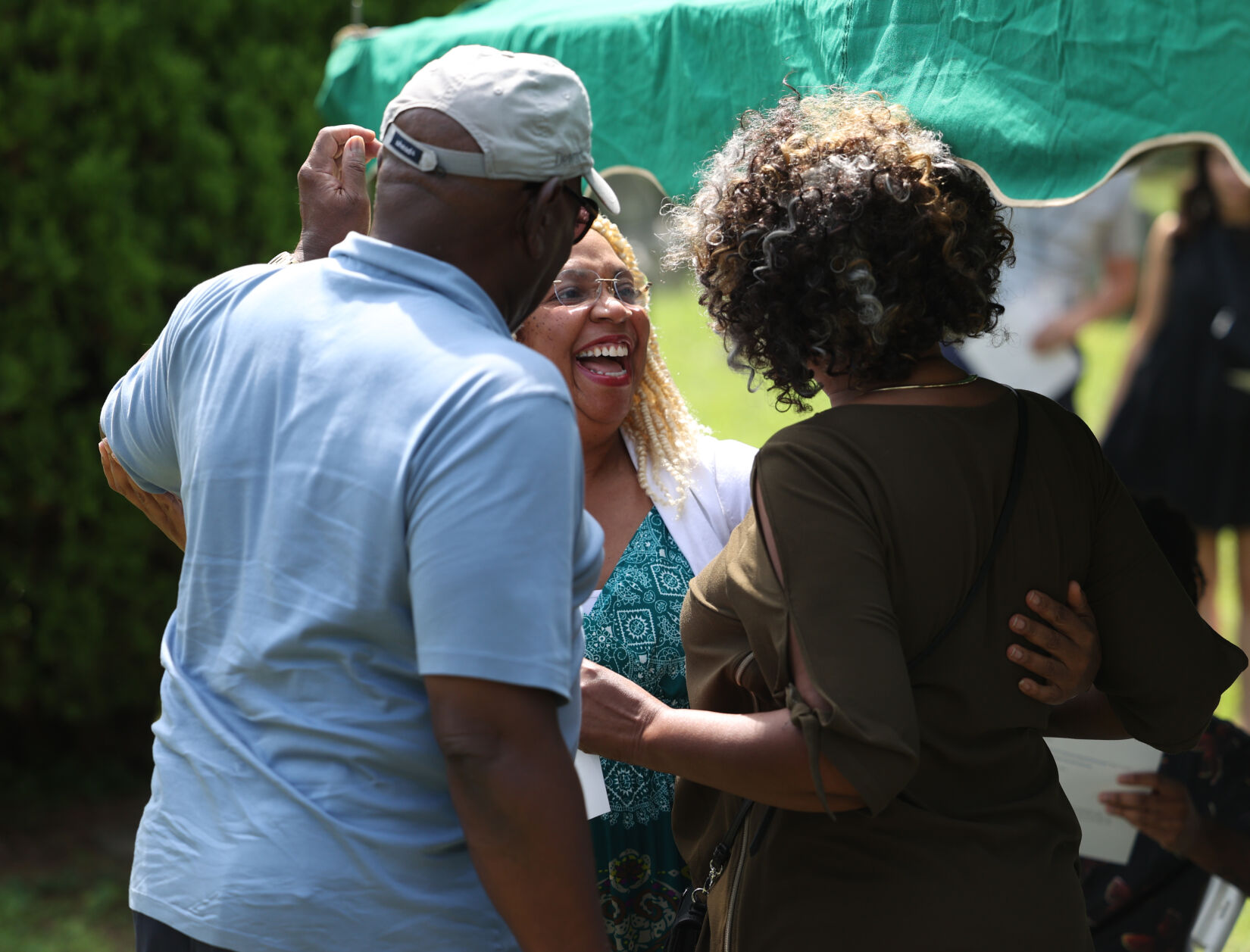 People speak prior to Felton Snow ceremony at Eastern Cemetery