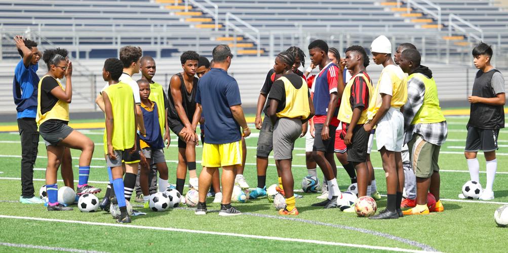 Players circle around at Shawnee soccer practice.JPG