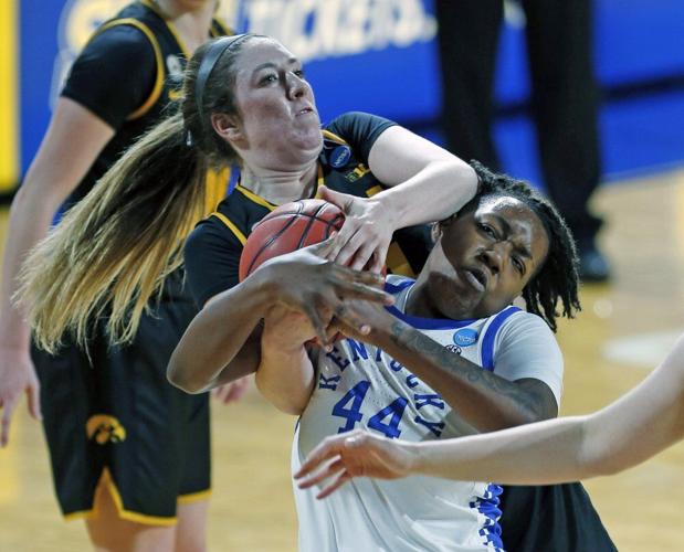 Iowa guard McKenna Warnock (14) ties up Kentucky guard Dre'una Edwards