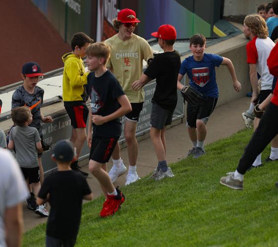 Children go for home run ball on berm.JPG