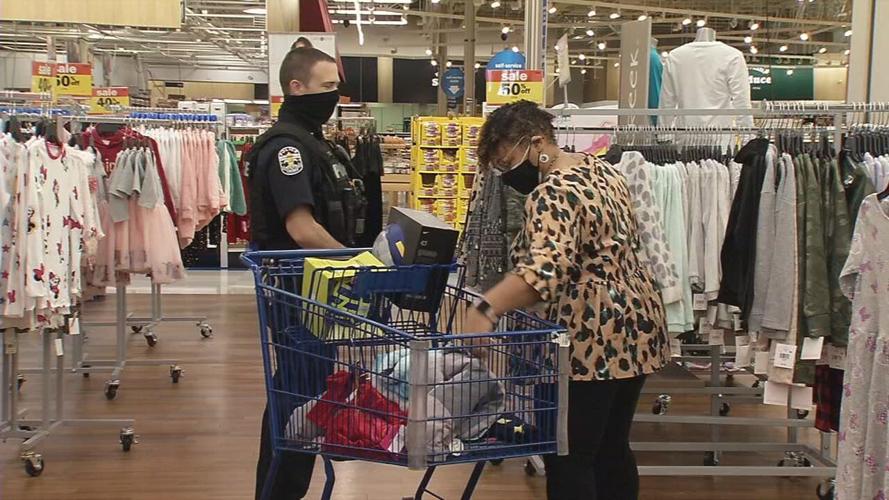 Shop with Cop 2020 - LMPD officer and teacher near cart