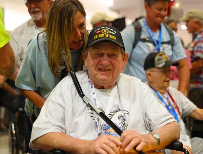 Veteran smiles after landing for Honor Flight Return Home trip.JPG