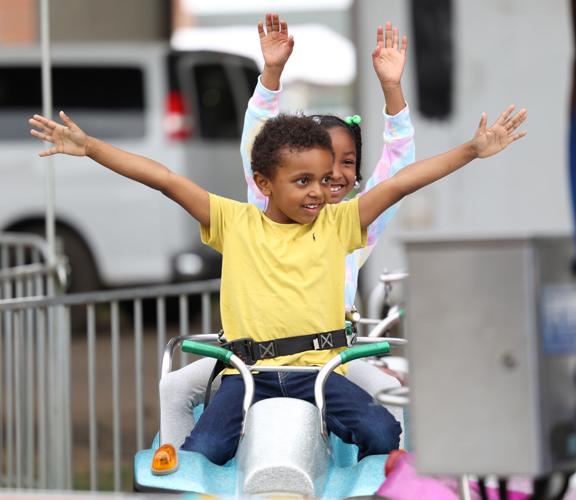 Two children on a ride at the Chow Wagon