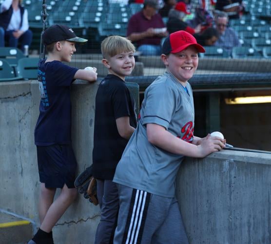 Boys wait by Bats dugout.JPG