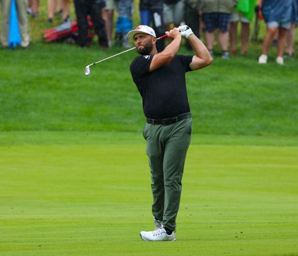 Jon Rahm hits a shot on the fairway.JPG