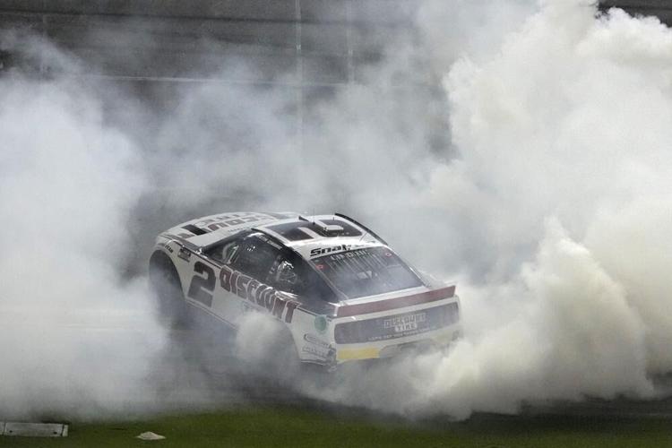 Austin Cindric celebrates after winning the NASCAR Daytona 500 auto race.jpeg