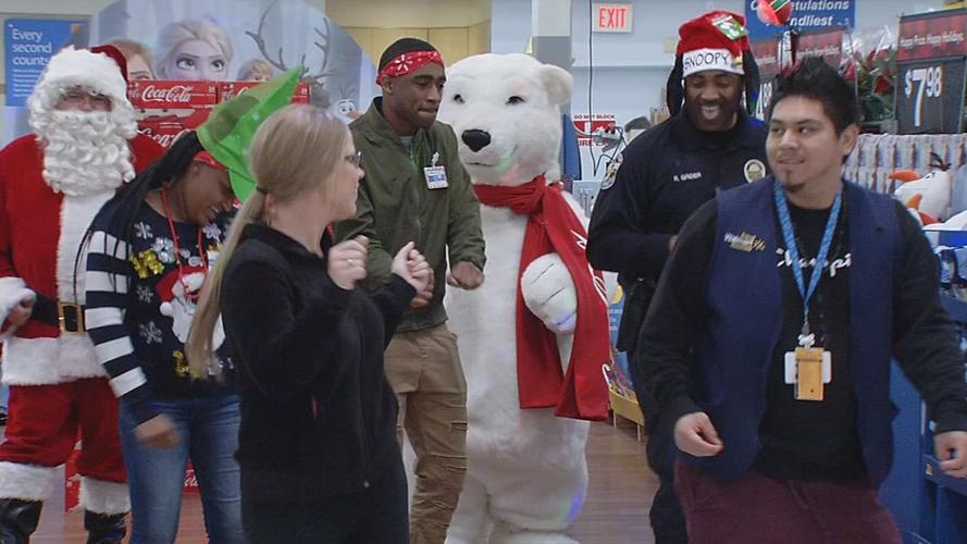 Metro Police Officers surprise Walmart shoppers with gift cards