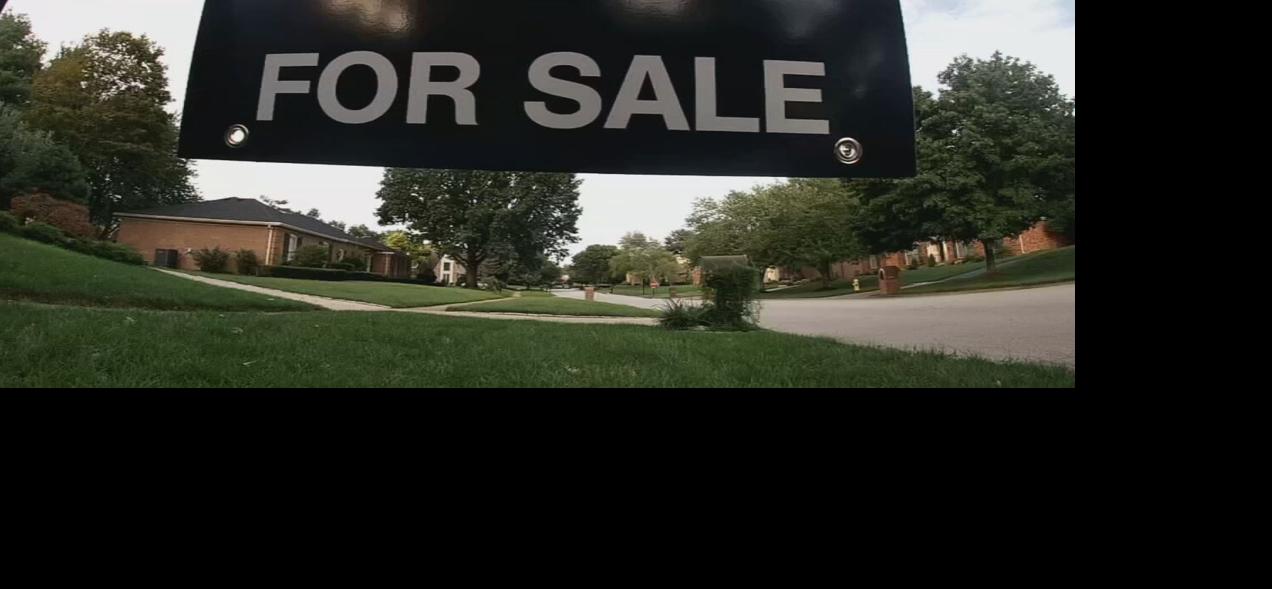 For sale sign hangs outside Louisville home