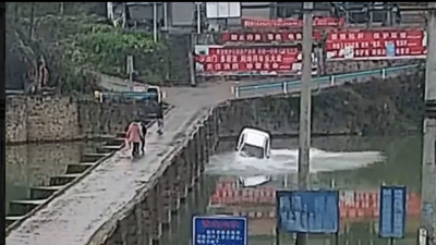Man in China drives car off bridge