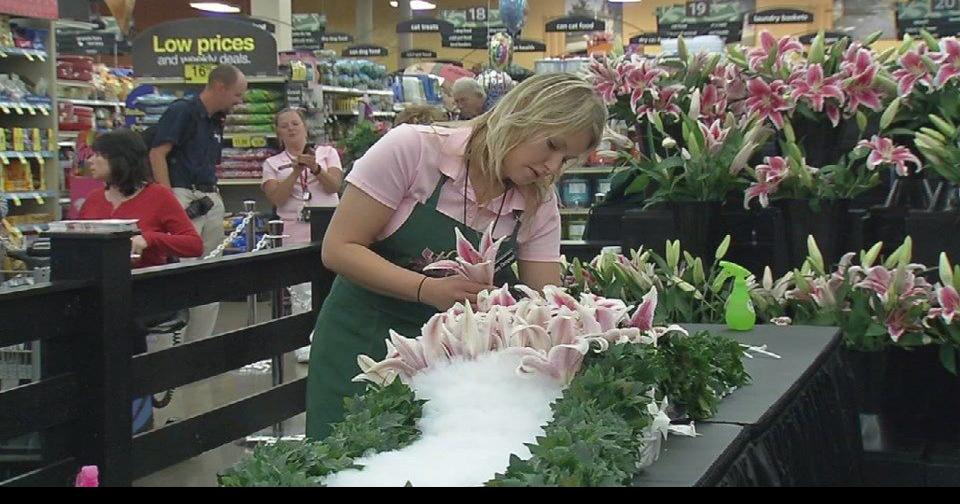 Workers at Kroger finish Garland of Lilies ahead of Friday's Oaks race