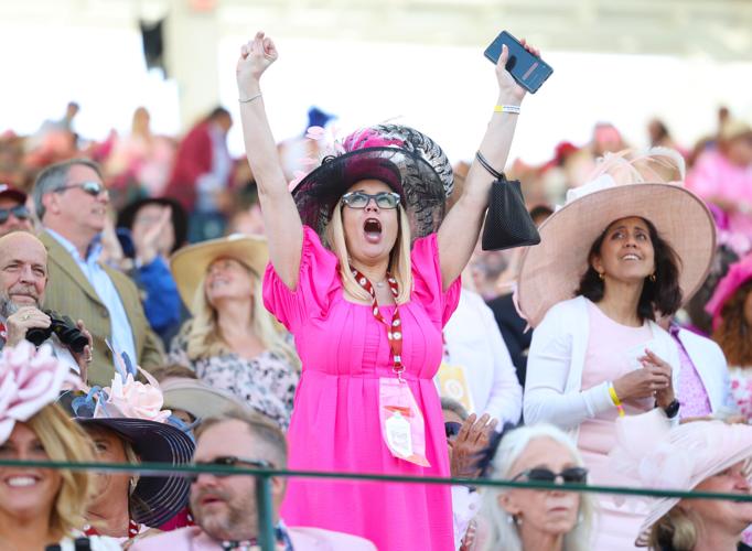 Woman raises arms in excitement.JPG