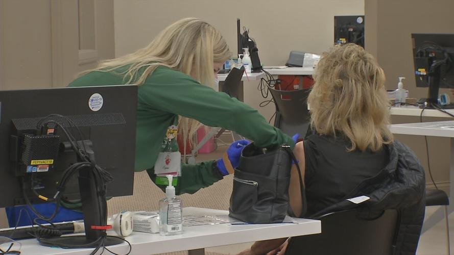 Woman gets COVID-19 vaccine.jpeg