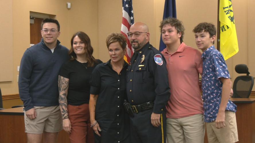 Newly sworn-in Jeffersonville Police Chief Michael "Scott" McVoy with his family
