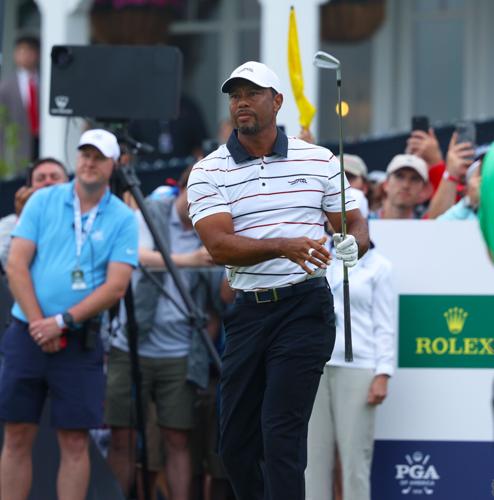 Tiger Woods hits at 13th tee box.JPG