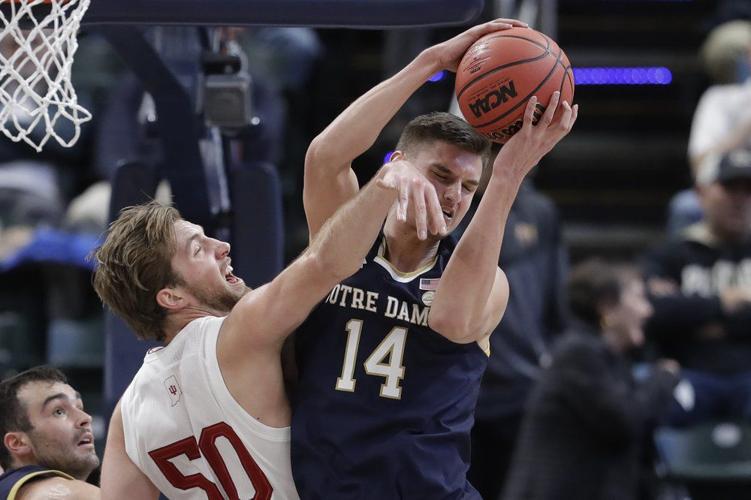 Notre Dame's Nate Laszewski (14) grabs a rebound from Indiana's Joey Brunk