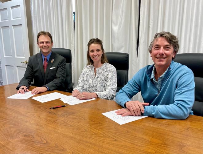 Madison Mayor Bob Courtney, SuperATV President Lindsay Hunt, and Redevelopment Commission President John Grote
