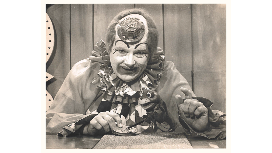 Presto the Magic Clown looks into camera