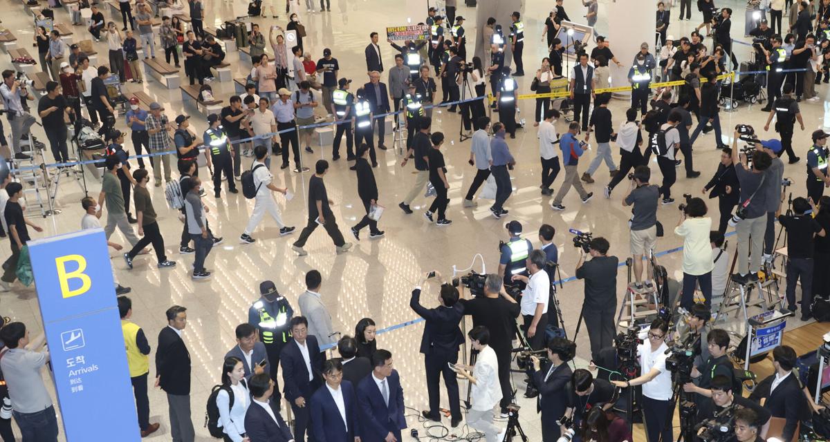 South Korean workers return home after days in detention following US