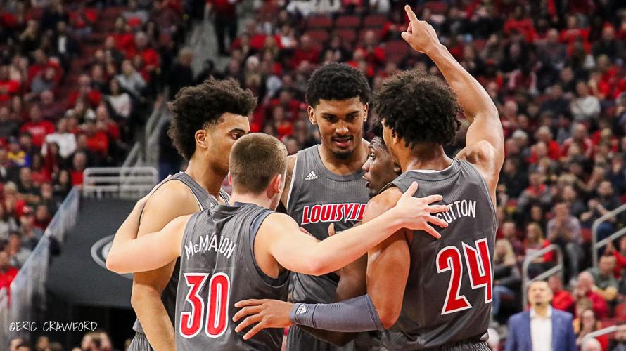 Louisville basketball huddle