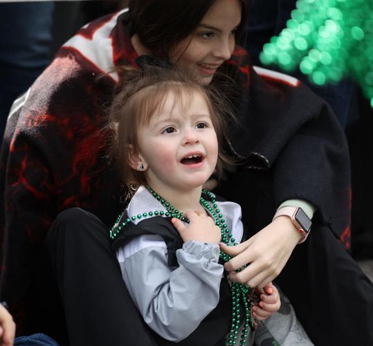 Girl looks onward at parade