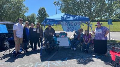 Family holds tailgating party outside Saint Joseph East in Lexington, telling expectant mom to 'push it!'