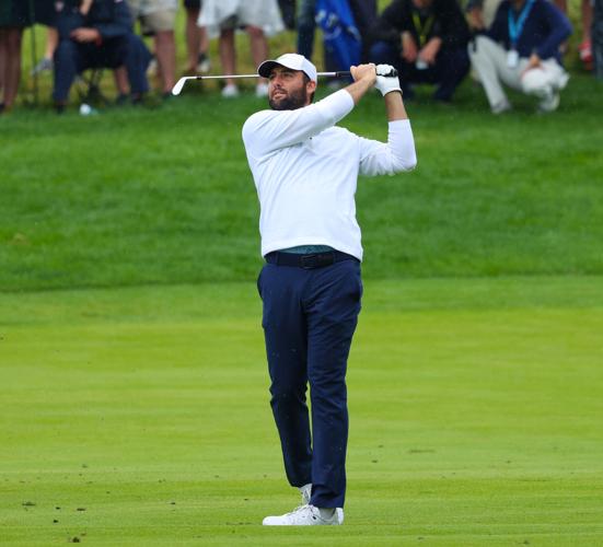 Scottie Scheffler hits an iron at the fairway.JPG