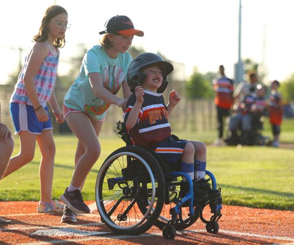 Clarksville Challenger player rolled to first base.JPG