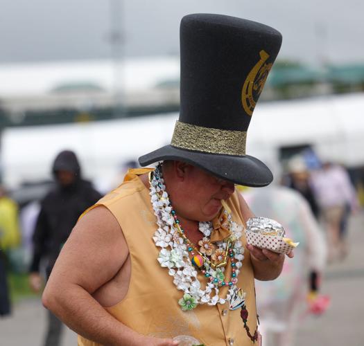 Man eats in Derby hat.JPG