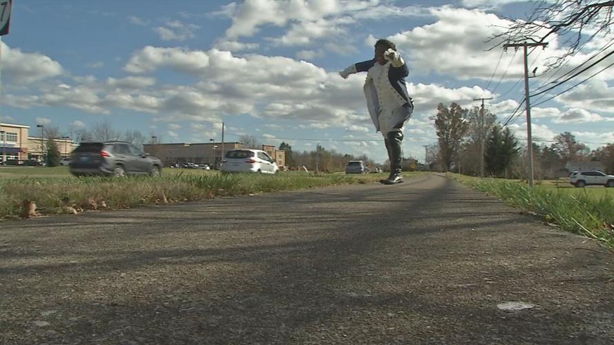 Performing 'Hamilton' hits, Male High School grad turns street into stage